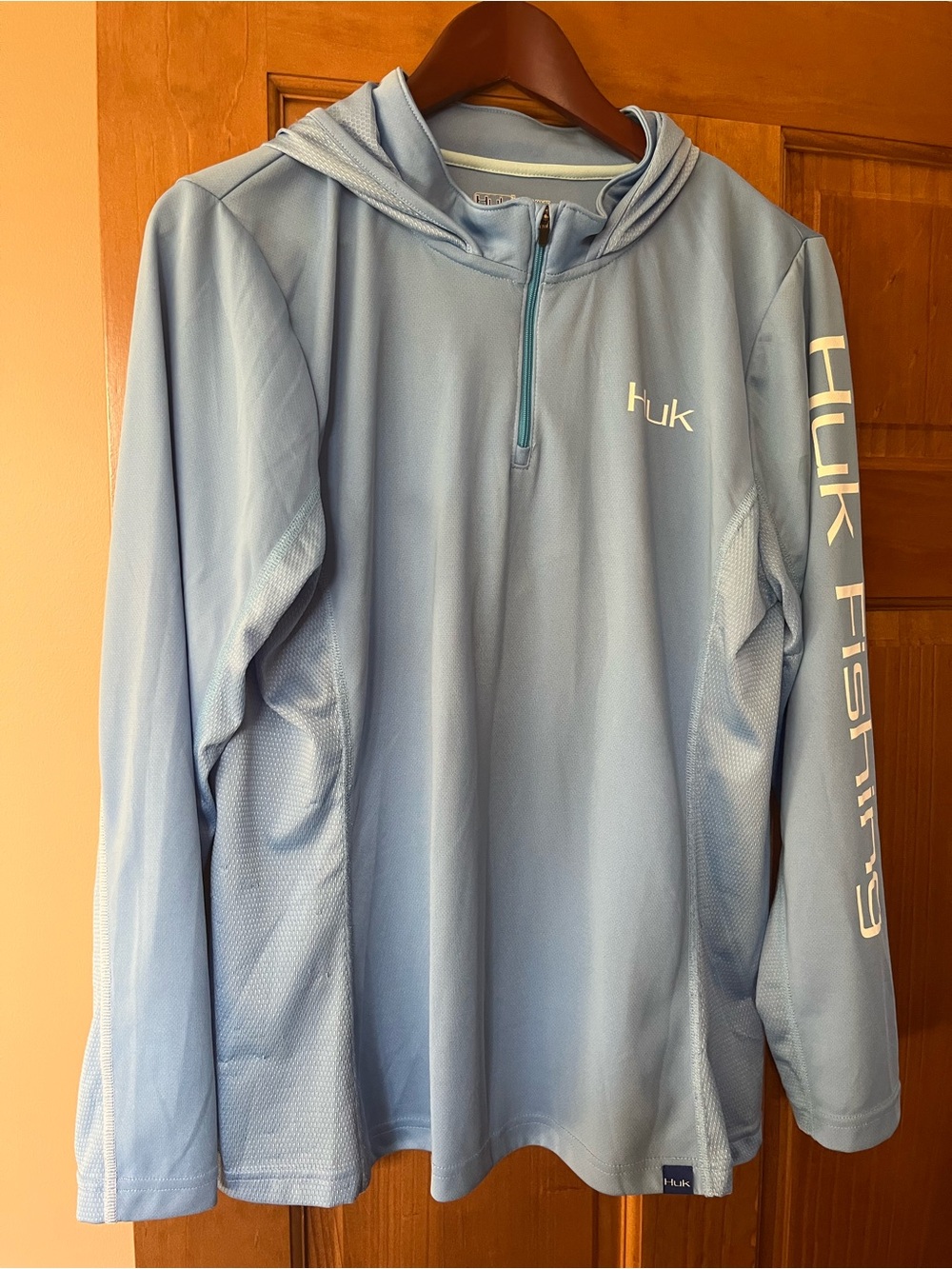 Huk Women’s Light Blue Fishing Hoodie - Sun Protection top
